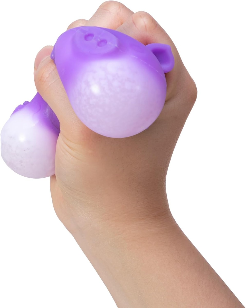 NeeDoh Dig It Pig — purple pig being squeezed