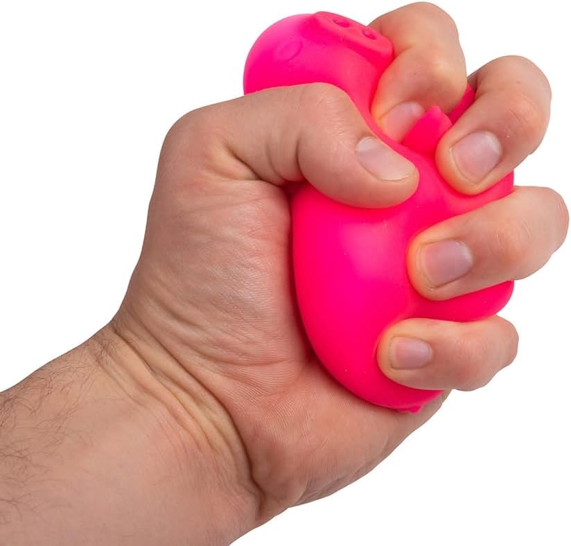 NeeDoh Dig It Pig — pink pig being squeezed