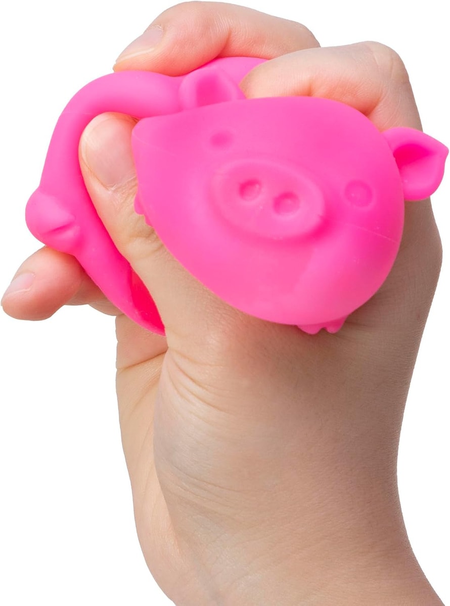 NeeDoh Dig It Pig — pink pig held in one hand