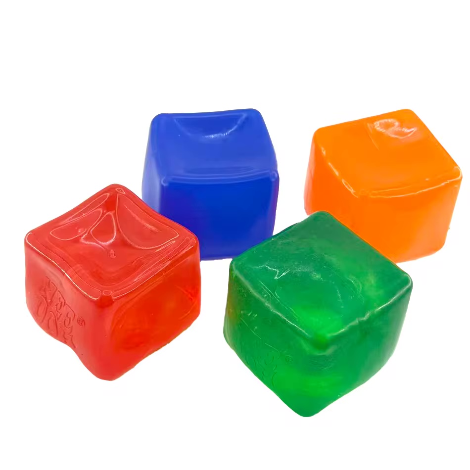 Glossy clear jelly cube soda-inspired squishy held in hand