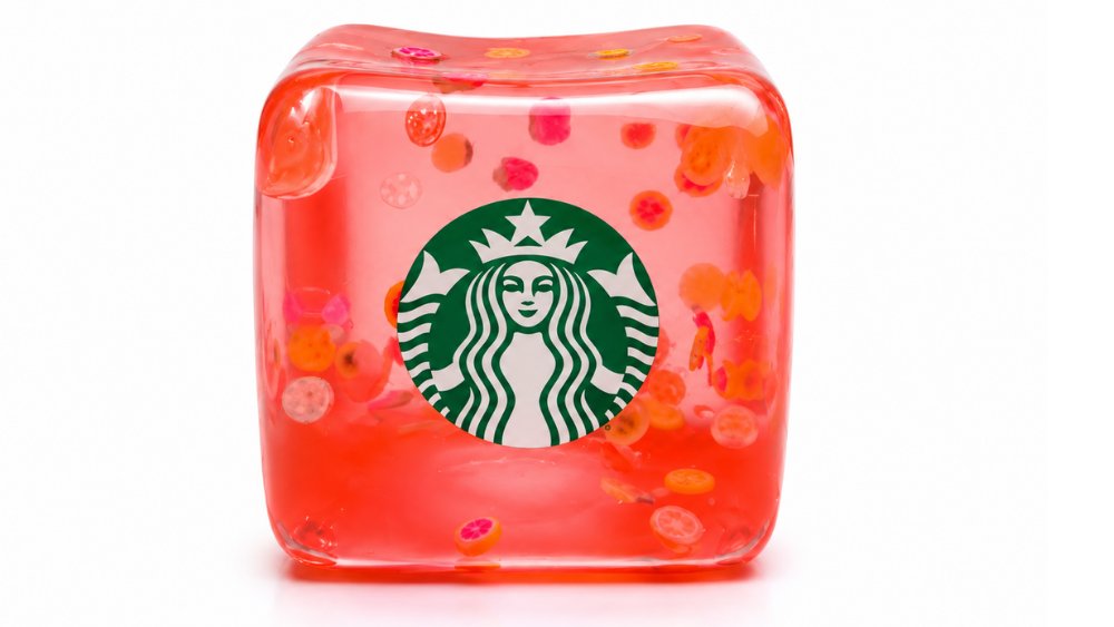 Translucent pink Starbucks squishy cube with fruit slices and a green Siren logo
